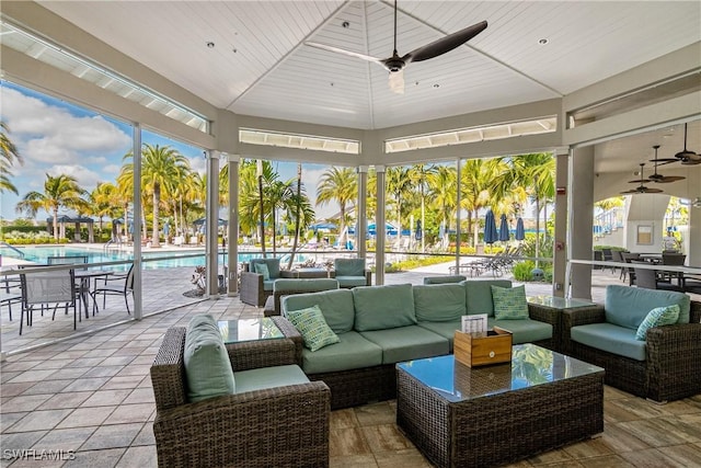 exterior space featuring a gazebo, an outdoor hangout area, and ceiling fan