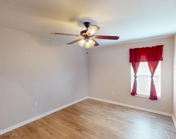 unfurnished room featuring ceiling fan and light wood-type flooring