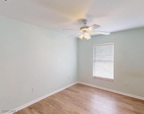 unfurnished room with ceiling fan and light hardwood / wood-style floors