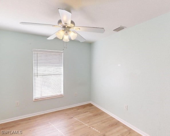 unfurnished room with ceiling fan and light wood-type flooring