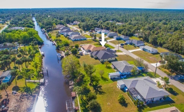 drone / aerial view with a water view