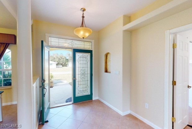 entrance foyer featuring light tile patterned flooring