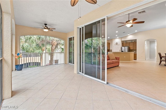 view of patio featuring ceiling fan and an outdoor kitchen