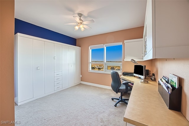 carpeted home office with ceiling fan