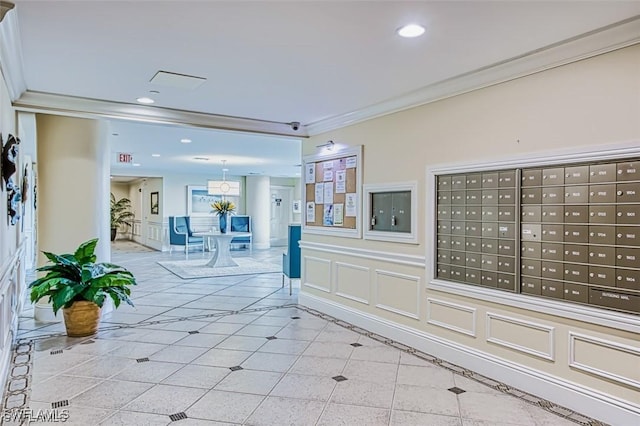 hall featuring ornamental molding, mail boxes, and light tile patterned flooring