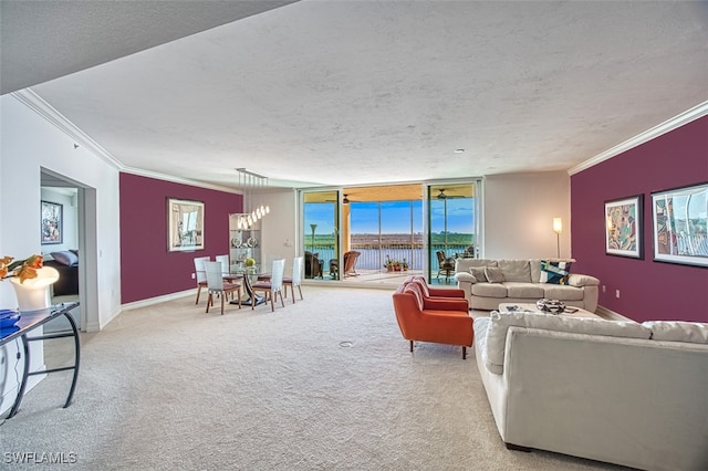 carpeted living room with a water view, ornamental molding, and a textured ceiling