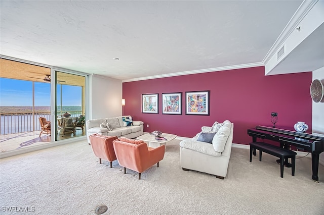 living room featuring a water view, ornamental molding, carpet floors, and expansive windows