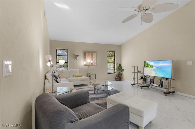 living room featuring ceiling fan, light tile patterned flooring, and lofted ceiling