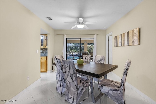 dining area featuring ceiling fan and light tile patterned floors