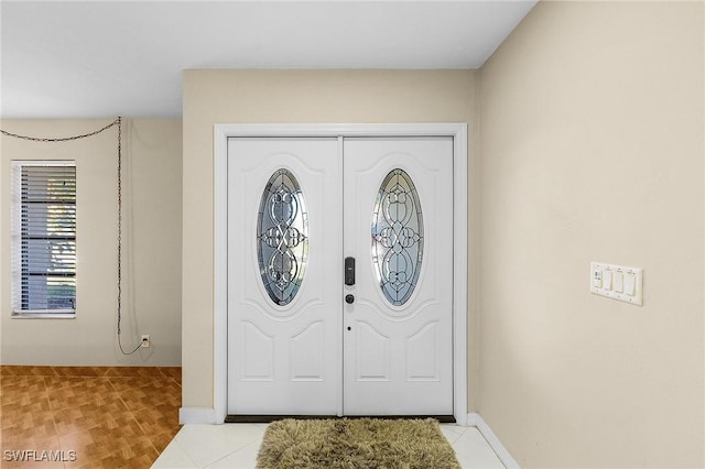 foyer with light wood-type flooring