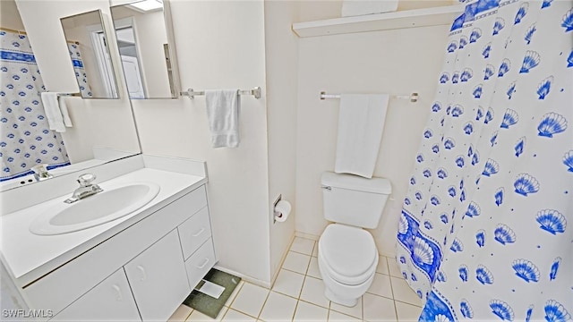 bathroom featuring toilet, tile patterned flooring, vanity, and a shower with curtain