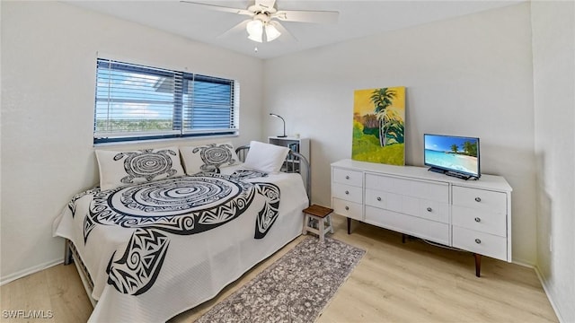 bedroom featuring ceiling fan and light hardwood / wood-style flooring