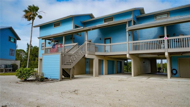 rear view of house featuring a carport