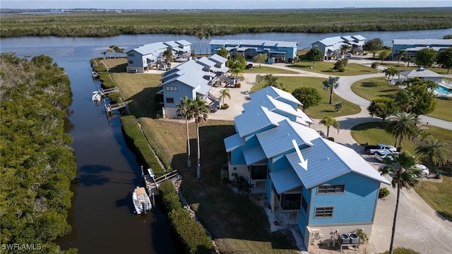 bird's eye view with a water view