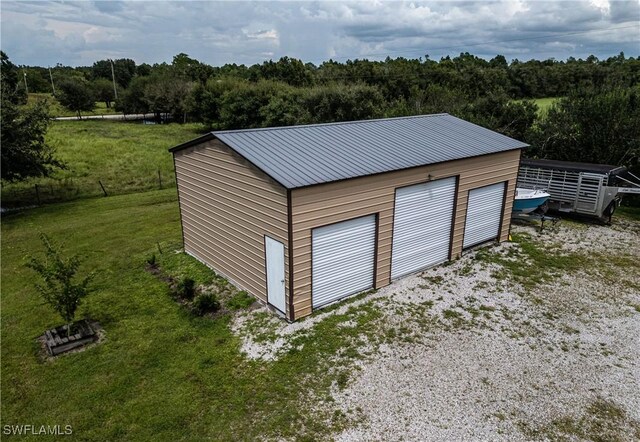 garage featuring a yard