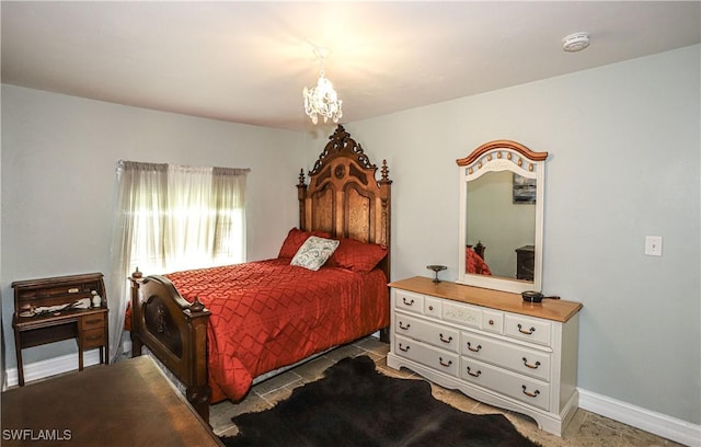 bedroom with an inviting chandelier