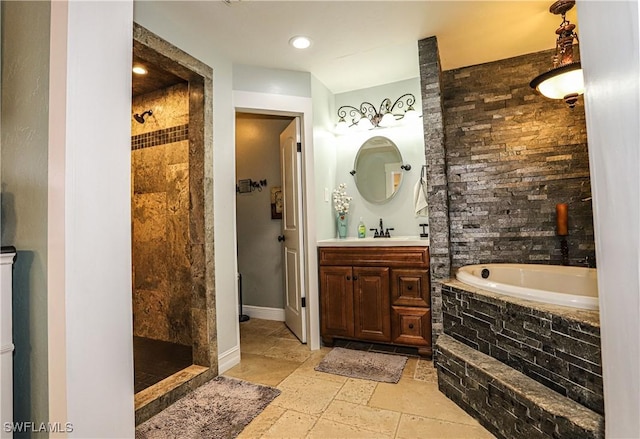 bathroom with vanity and separate shower and tub