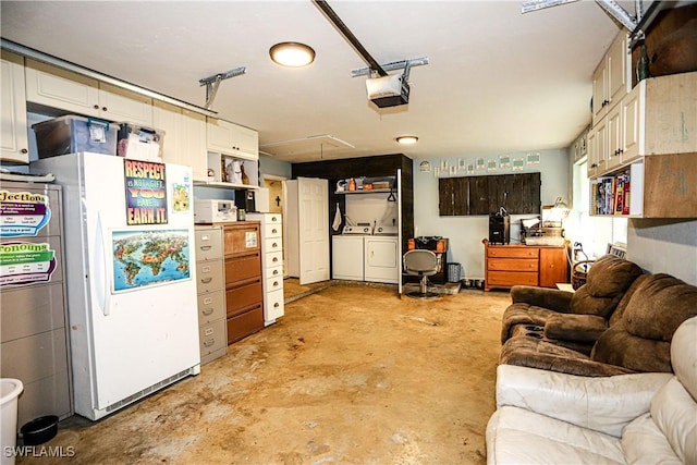 garage with a garage door opener, washing machine and dryer, and white refrigerator