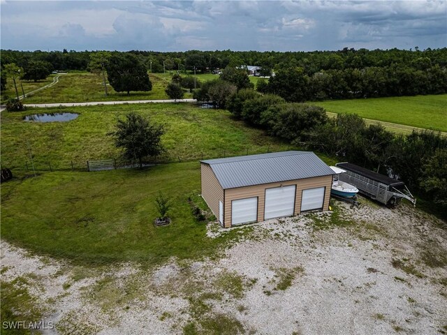 birds eye view of property featuring a rural view