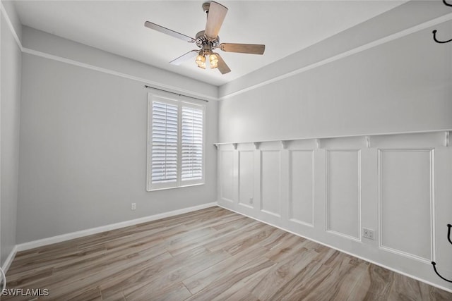 spare room with ceiling fan and light wood-type flooring