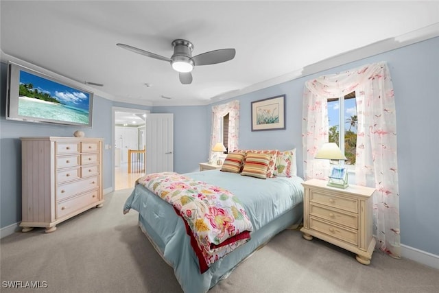 4353 Gulf Pines Dr, Sanibel, FL 33957 - bedroom with light colored carpet, ceiling fan, and crown molding