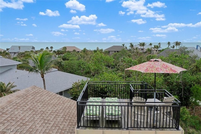 wooden deck featuring a water view