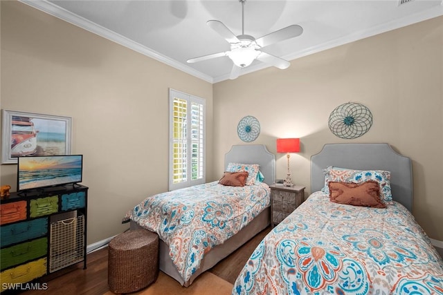 bedroom featuring ornamental molding, ceiling fan, and hardwood / wood-style flooring