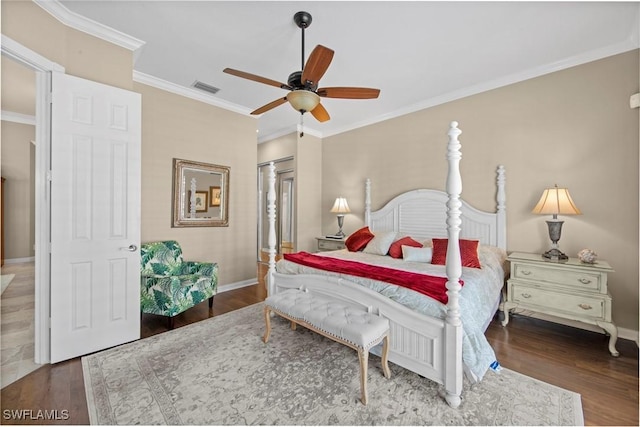 bedroom with ceiling fan, dark hardwood / wood-style flooring, ornamental molding, and a closet