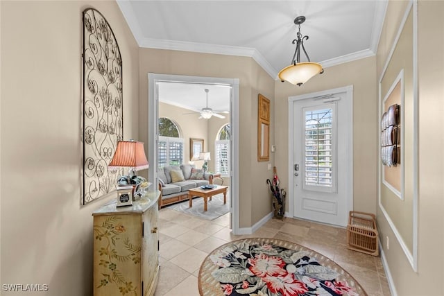 foyer featuring ornamental molding and ceiling fan