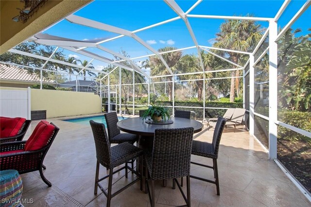 view of patio with glass enclosure