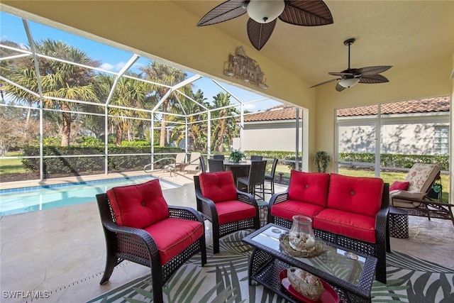 view of patio with a lanai, ceiling fan, and outdoor lounge area