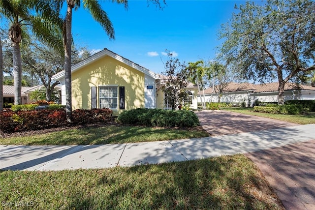 view of front of home with a front lawn