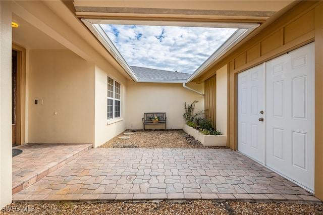 property entrance featuring a patio