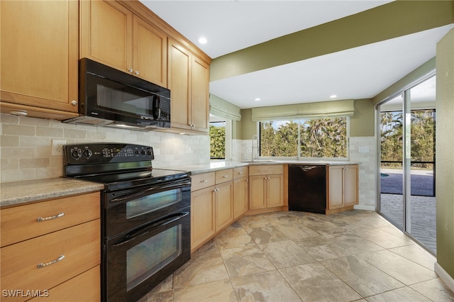 kitchen featuring sink and black appliances