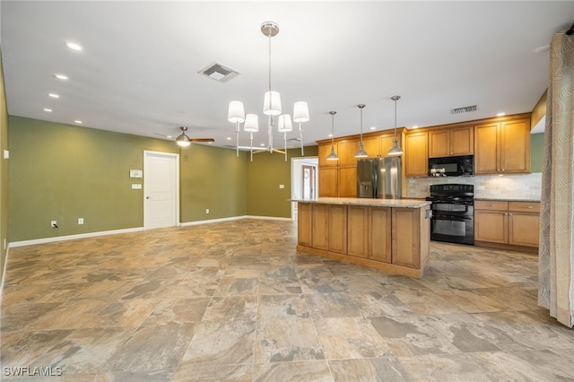 kitchen featuring decorative light fixtures, backsplash, a center island, ceiling fan, and black appliances