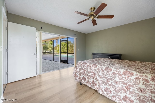 bedroom featuring access to outside, a textured ceiling, ceiling fan, and light hardwood / wood-style flooring