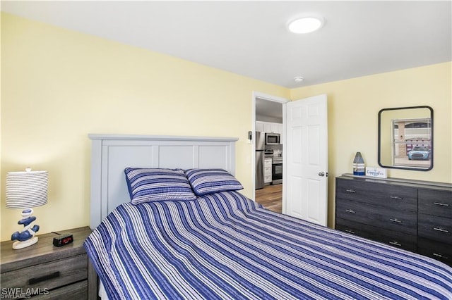 bedroom featuring hardwood / wood-style floors