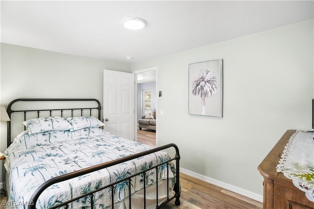 bedroom featuring wood-type flooring