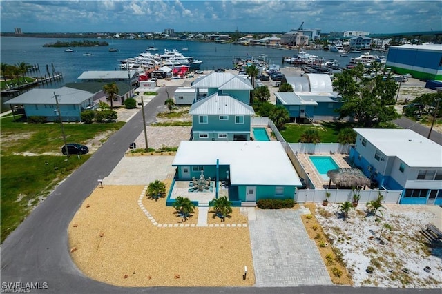 birds eye view of property featuring a water view