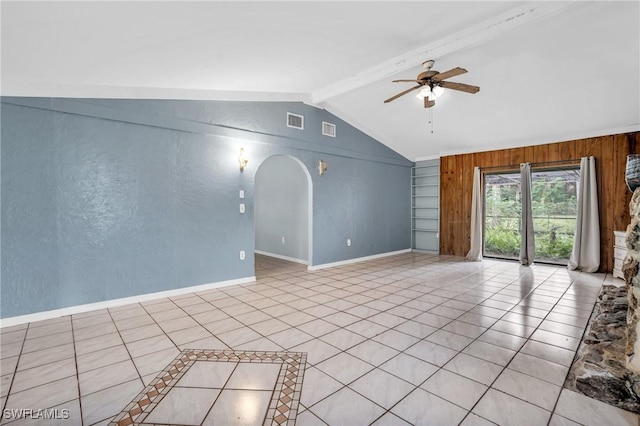 unfurnished living room featuring vaulted ceiling with beams, wooden walls, ceiling fan, and light tile patterned floors