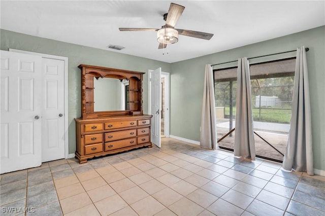 tiled bedroom with ceiling fan and access to outside