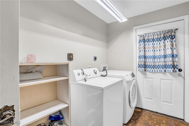 washroom featuring dark parquet floors and independent washer and dryer