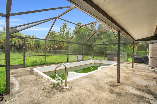 view of patio featuring a lanai