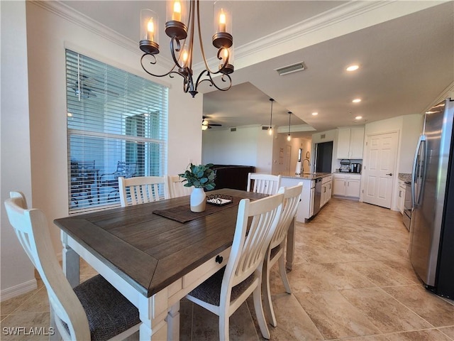 dining room with ceiling fan with notable chandelier and ornamental molding