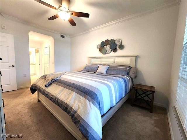 carpeted bedroom with ceiling fan, ensuite bathroom, and crown molding