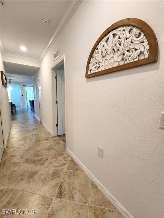 hallway with crown molding