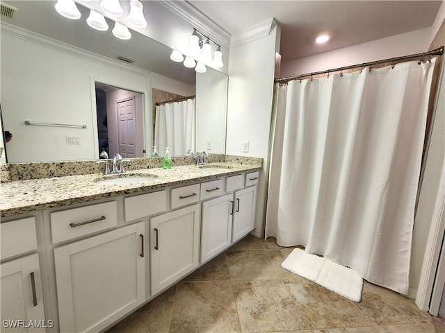 bathroom featuring vanity and ornamental molding