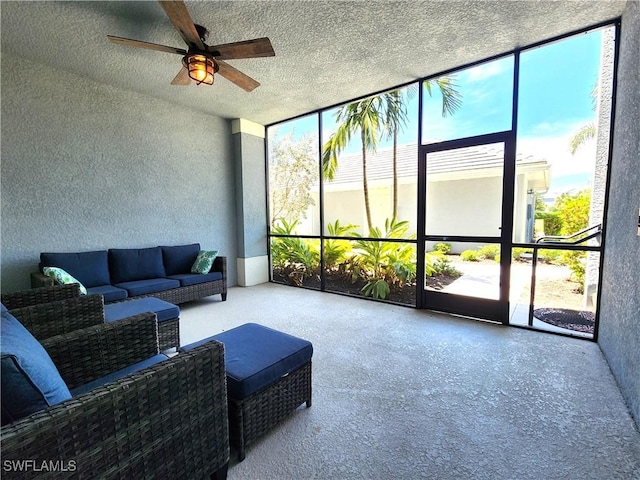 sunroom featuring ceiling fan and a healthy amount of sunlight