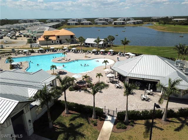 view of pool with a water view