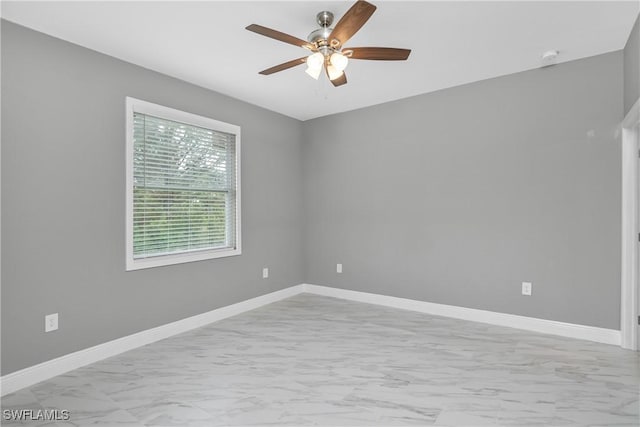 unfurnished room with ceiling fan